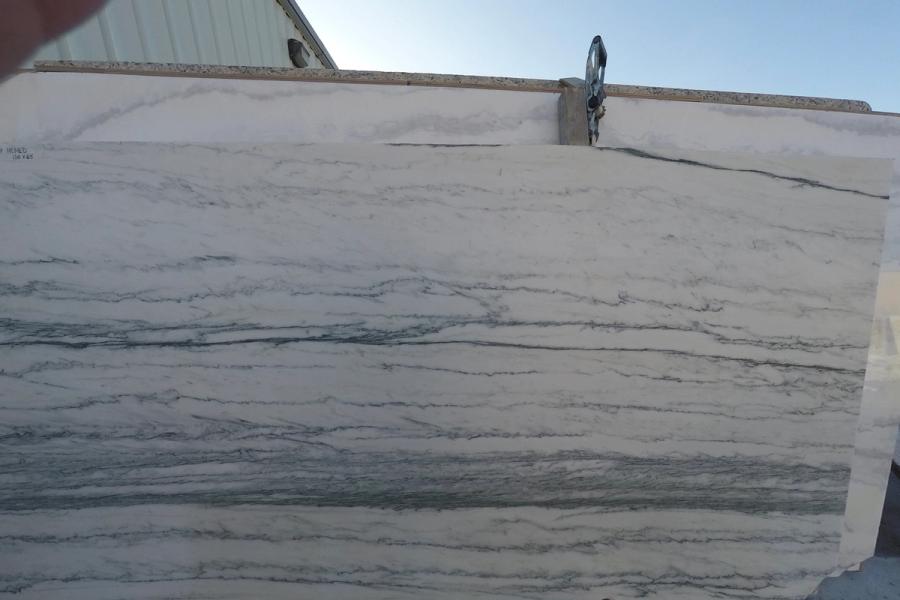 Marble slab — stone photographed in the yard, 120 by 60 inches