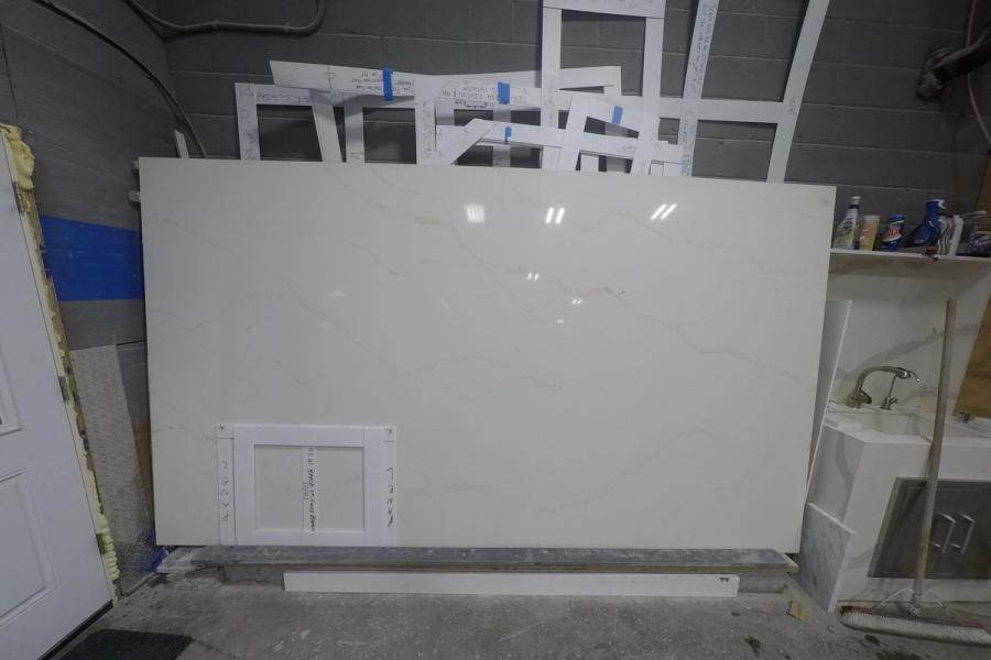 Quartz slab — stone photographed in the yard, 120 by 60 inches